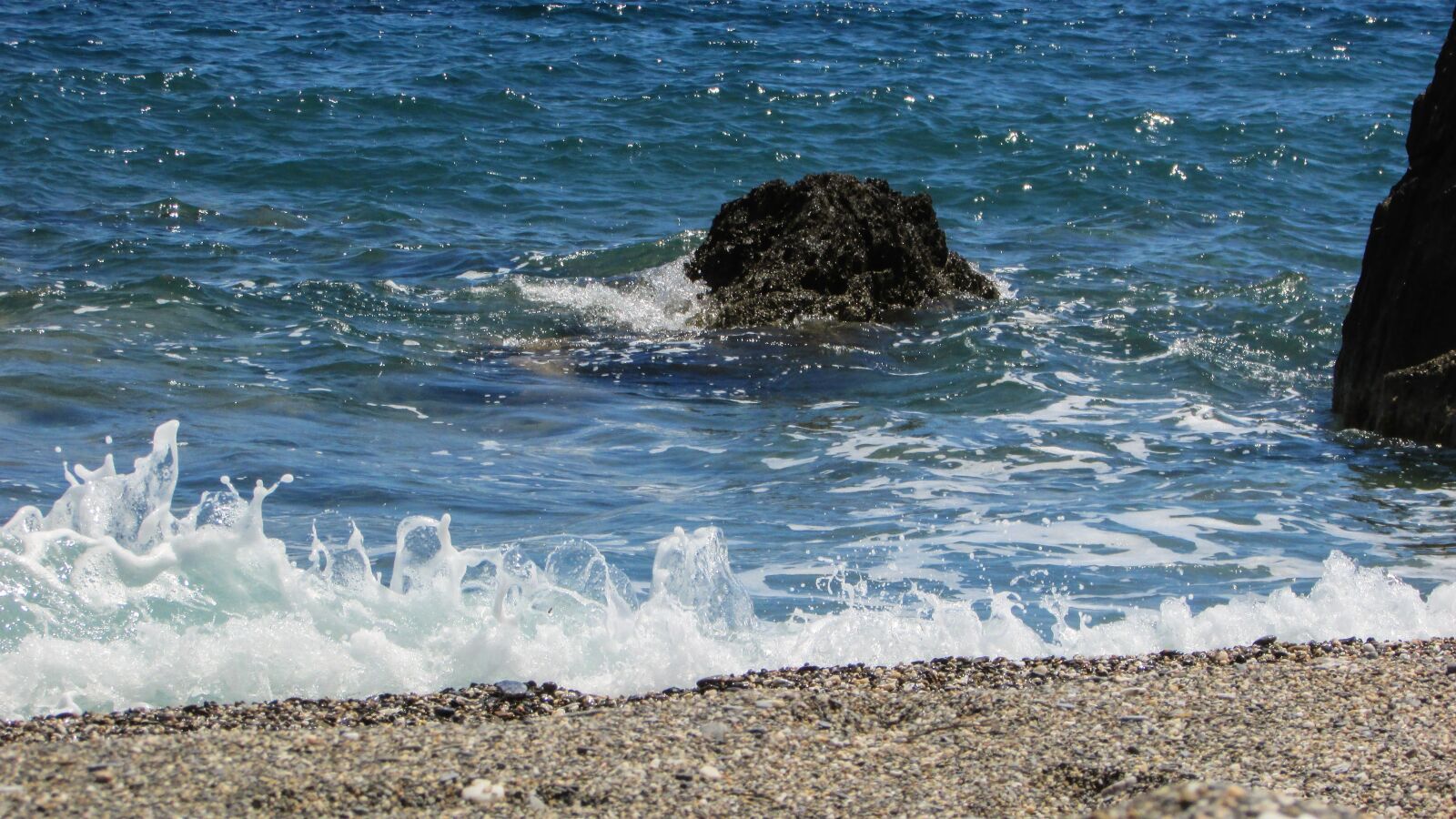 Canon PowerShot SX400 IS sample photo. Pebble, beach, sea photography