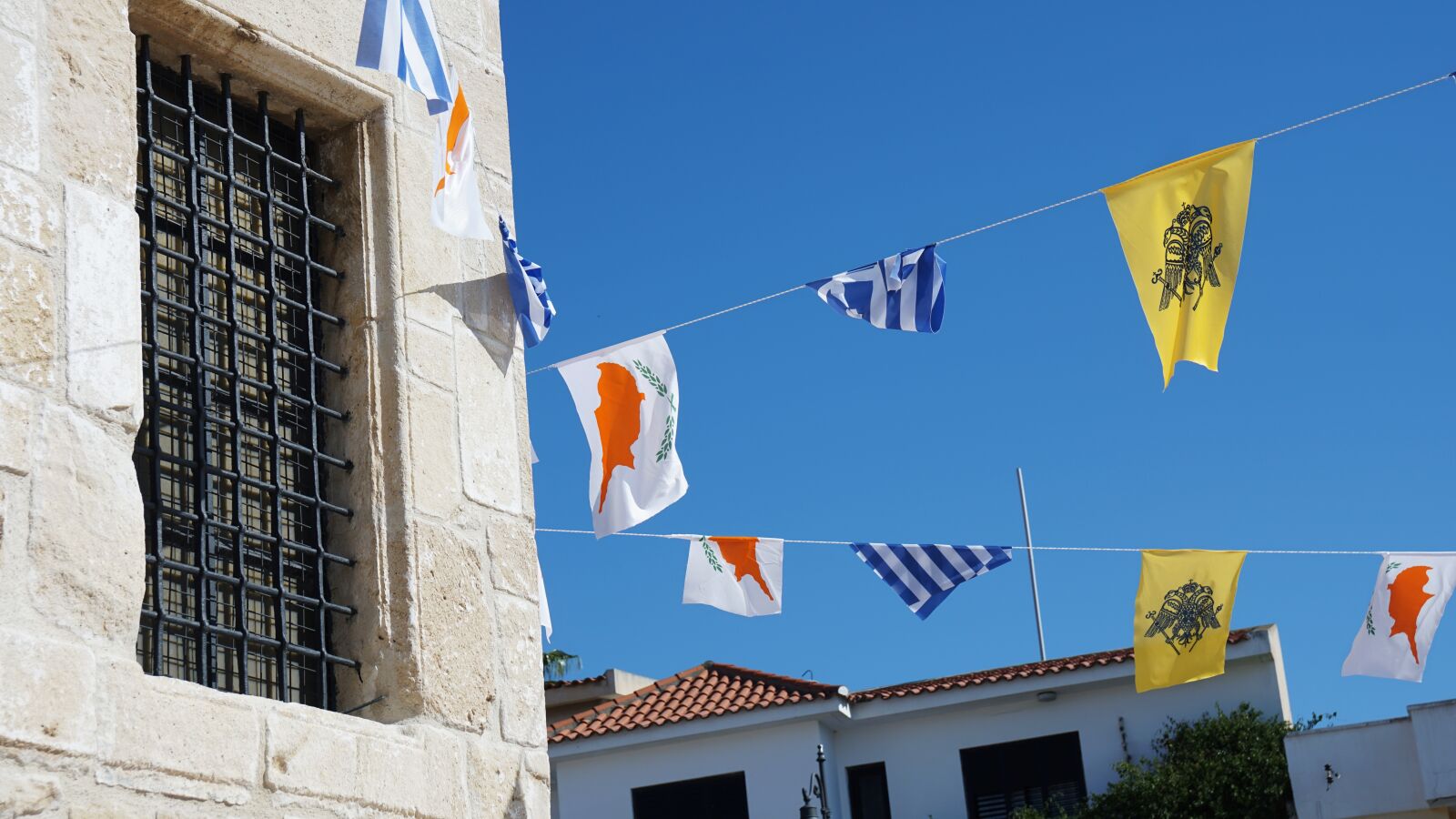 Sony a6000 + Sony Vario-Tessar T* E 16-70mm F4 ZA OSS sample photo. Cyprus, flags, flag photography
