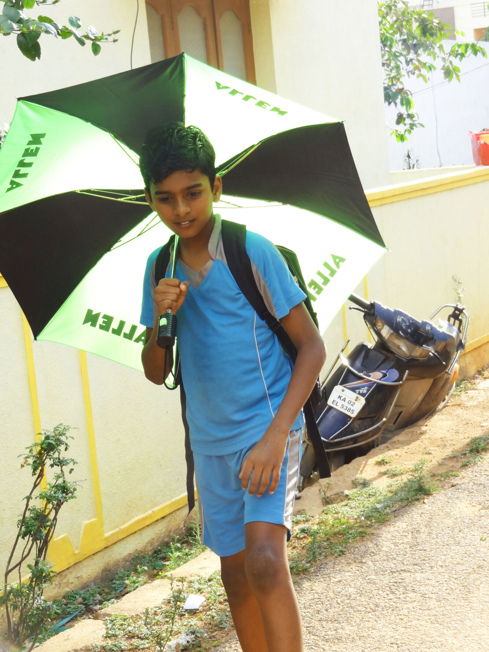 Sony Cyber-shot DSC-HX9V sample photo. Boy, walking, with, umbrella photography