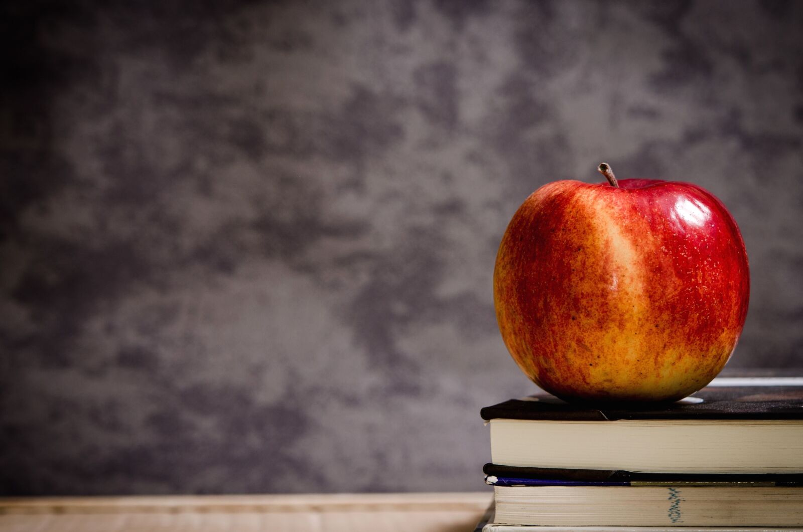 Nikon D5100 sample photo. Apple, book, fruit, reading photography
