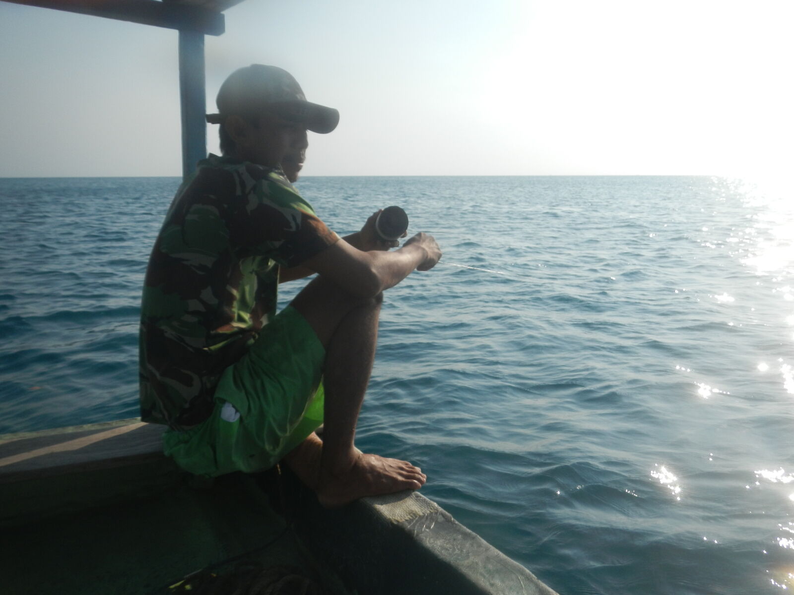 Nikon Coolpix AW100 sample photo. Fisherman, people, sea photography