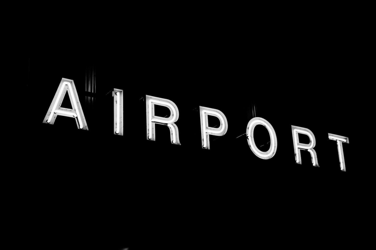 Sony DT 35mm F1.8 SAM sample photo. Sign, airport, neon, illuminated photography