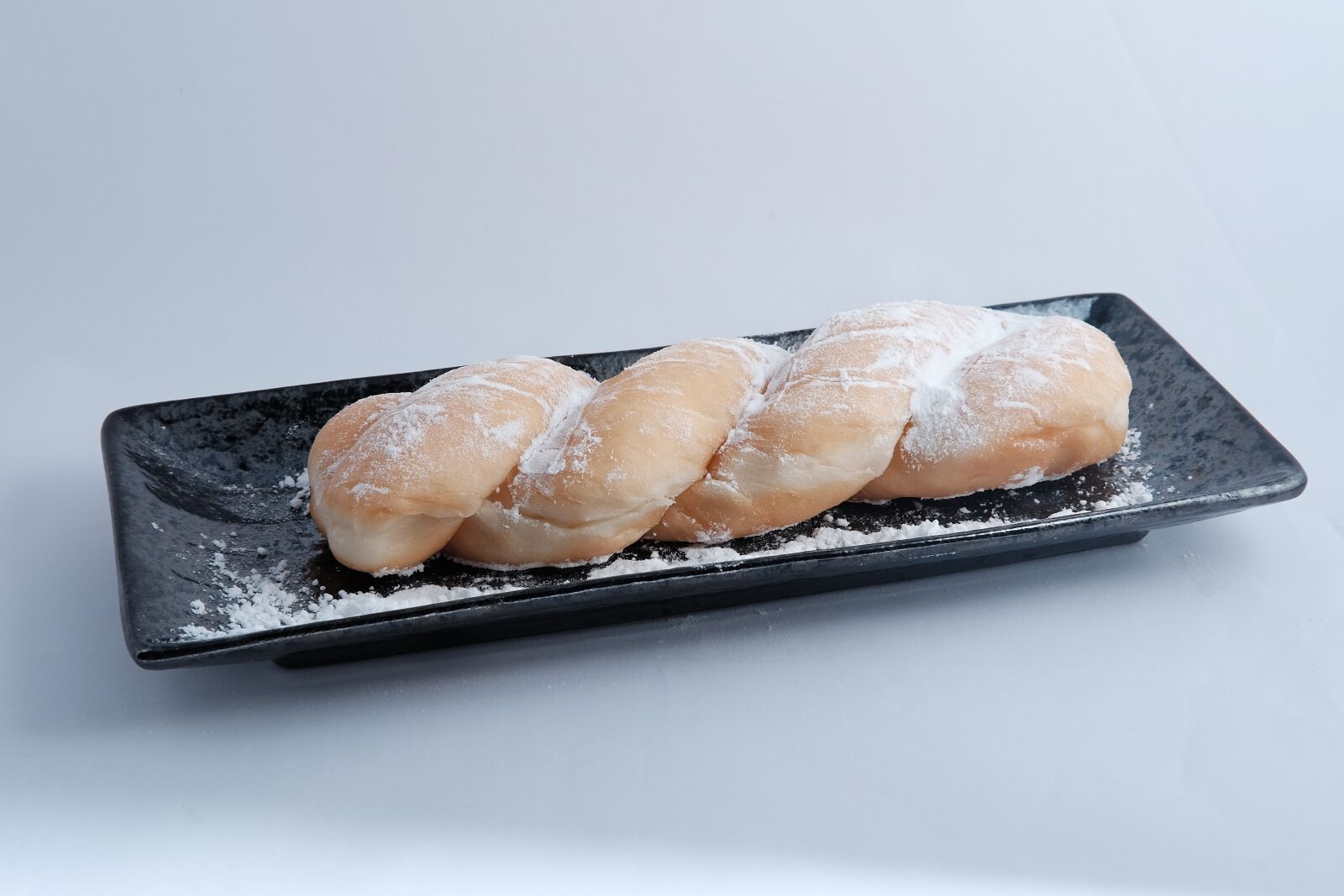 Fujifilm X-T1 + Fujifilm XF 35mm F2 R WR sample photo. Donut, twist, tray photography