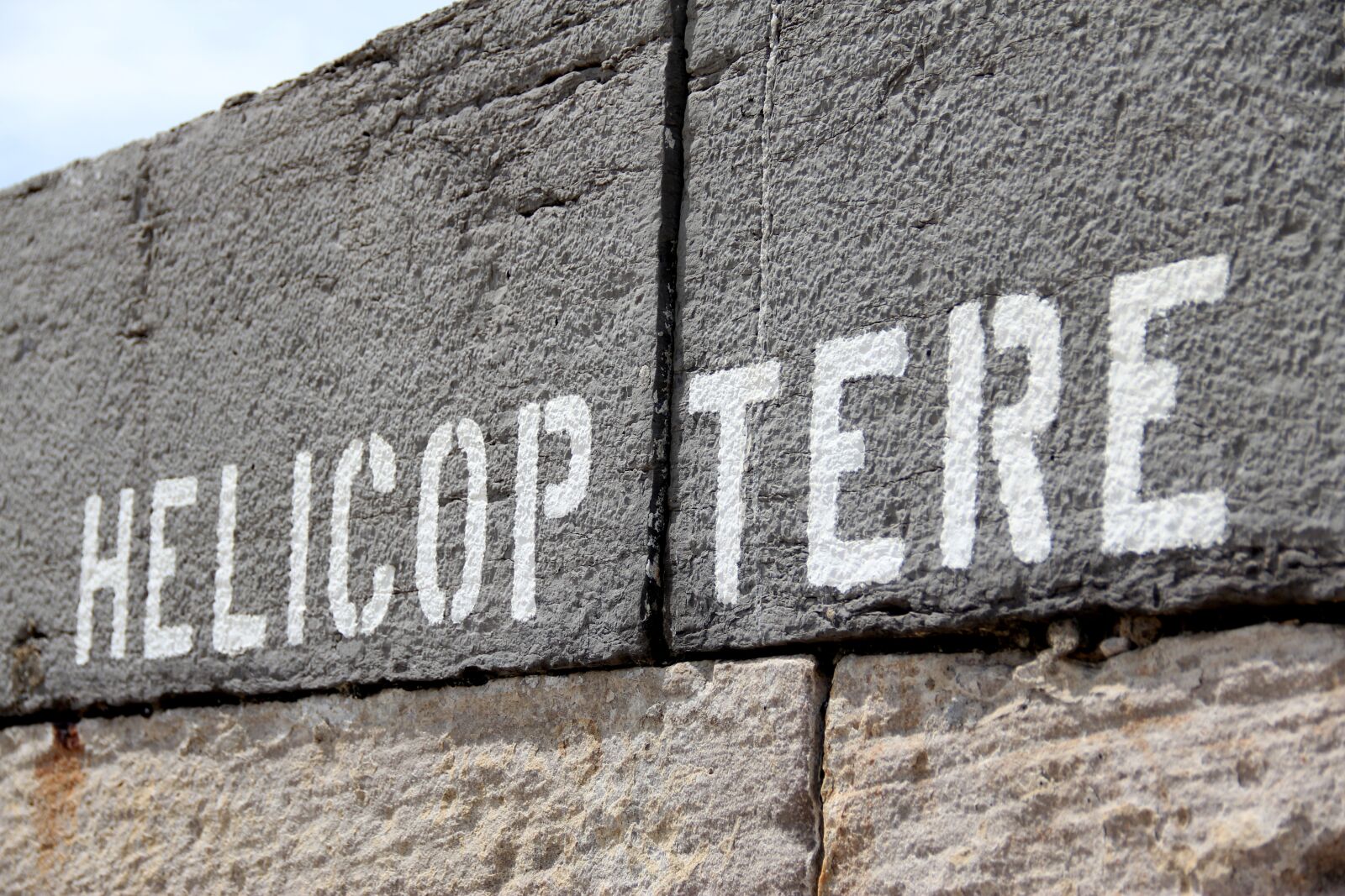 Canon EF-S 18-135mm F3.5-5.6 IS sample photo. Helicopter, wall, typography photography