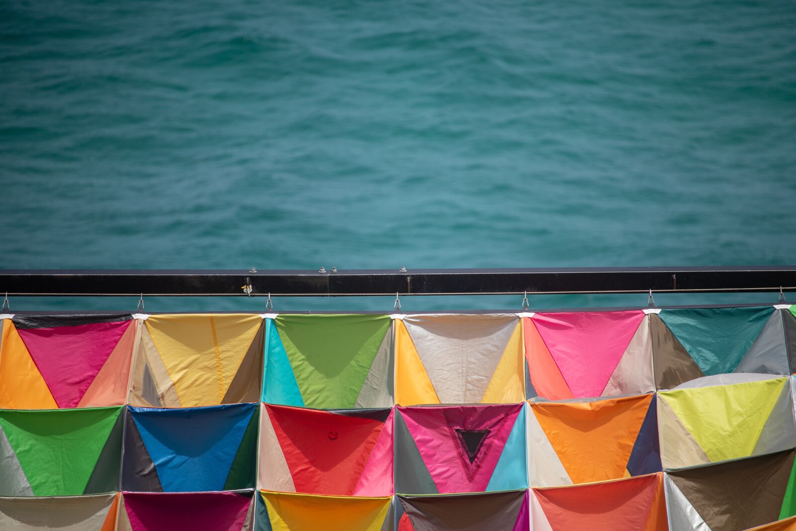 Canon EF-S 55-250mm F4-5.6 IS STM sample photo. Sea, ocean, flags photography