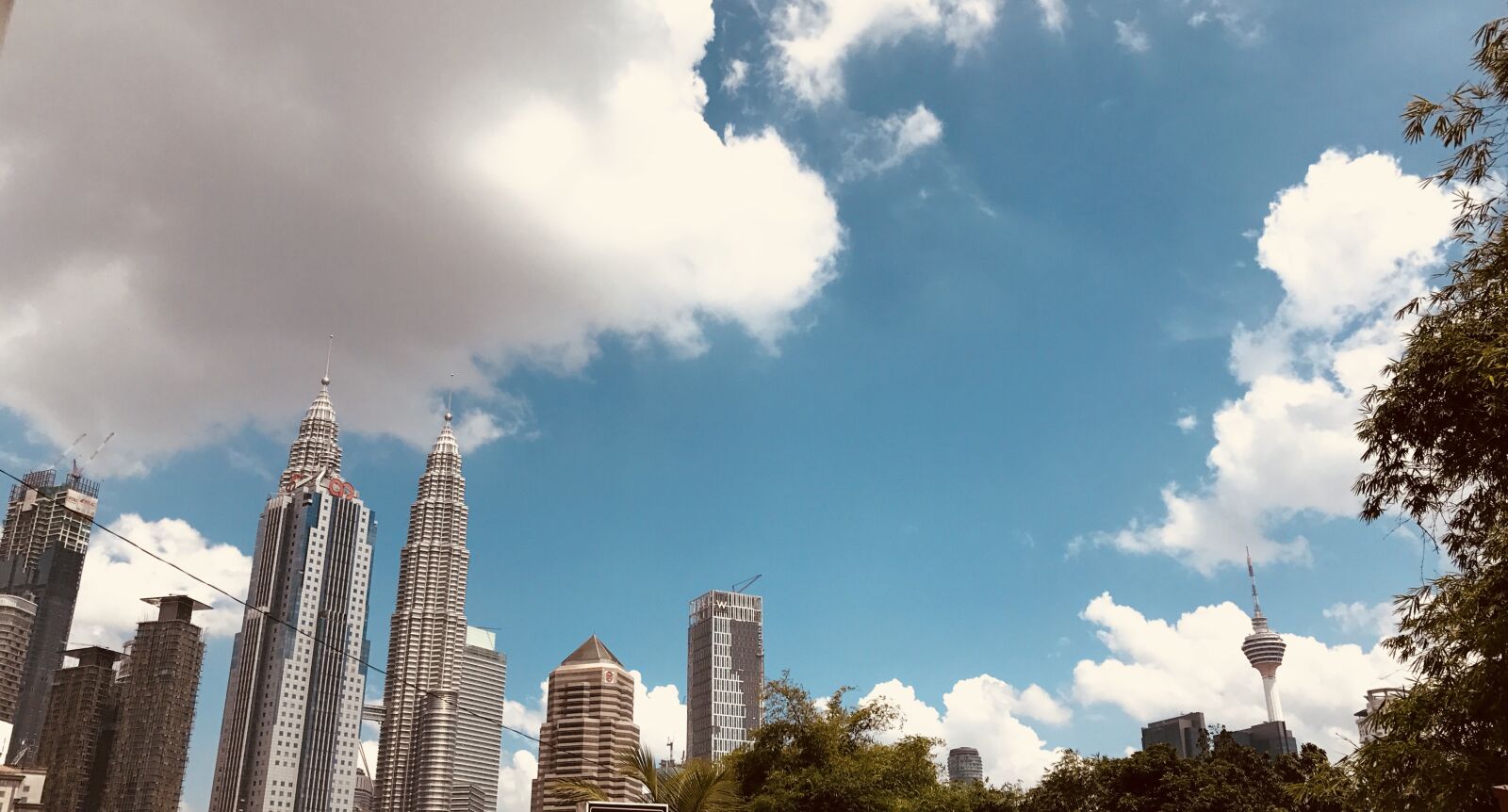 iPhone 7 back camera 3.99mm f/1.8 sample photo. City, sky, klcc photography