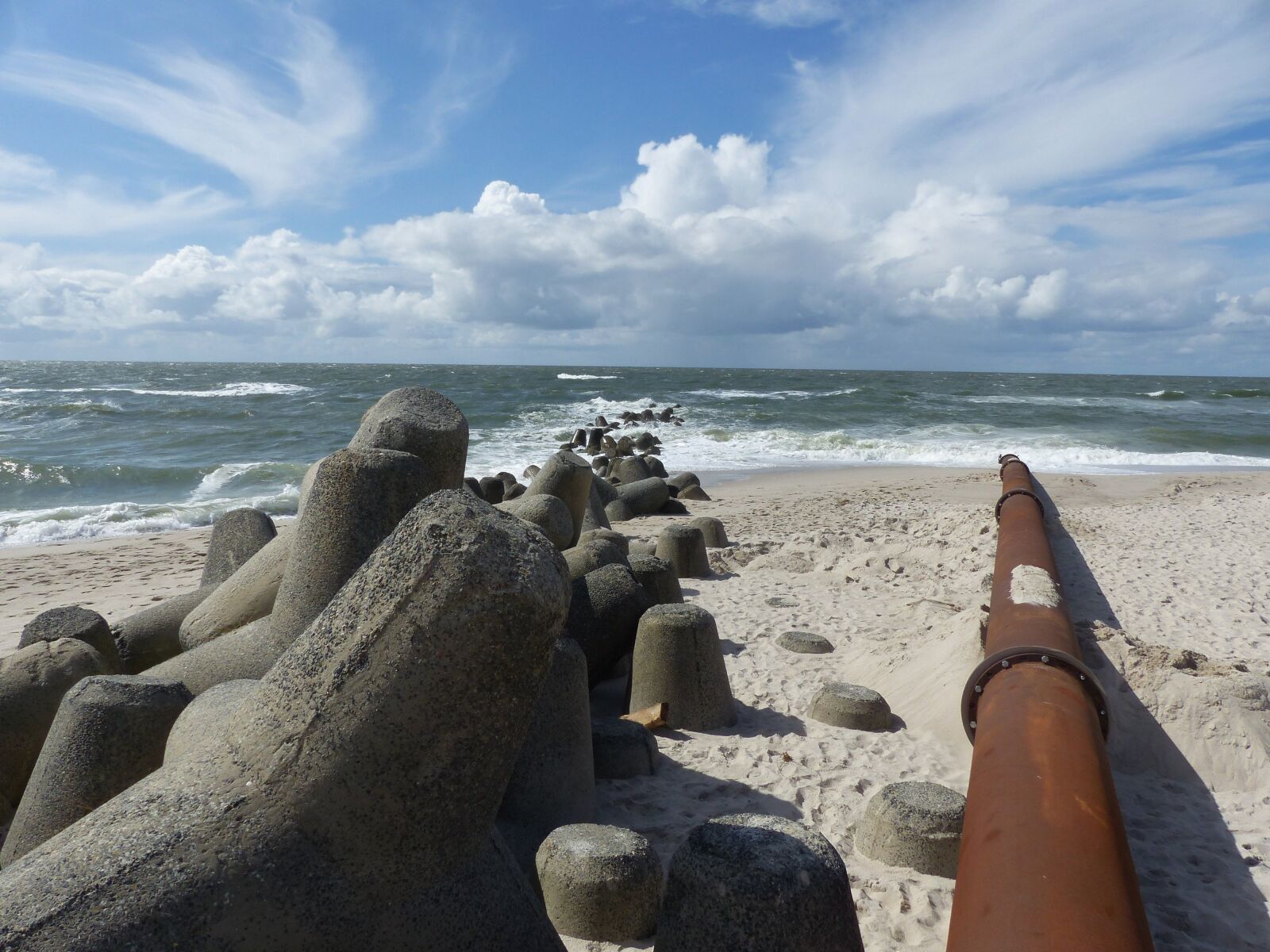 Panasonic Lumix DMC-FZ200 sample photo. Breakwater, pipeline, rusty photography