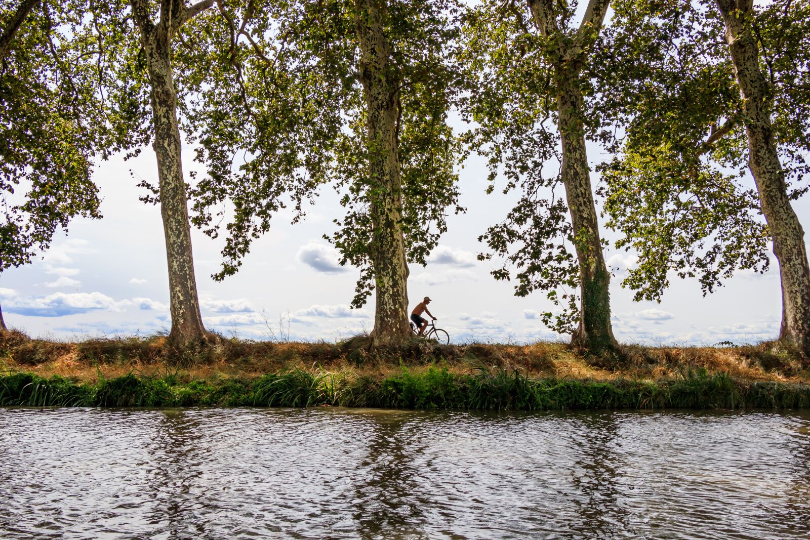 Canon EF-S 18-135mm F3.5-5.6 IS USM sample photo. Cyclists, canal du midi photography