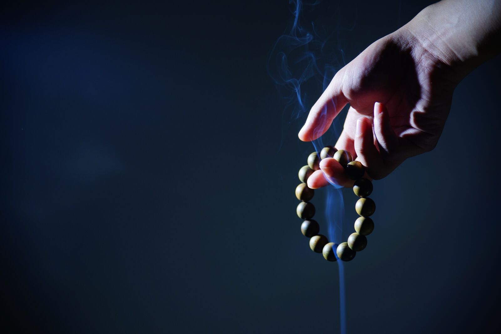 Sony a99 II sample photo. Hand, buddhist prayer beads photography