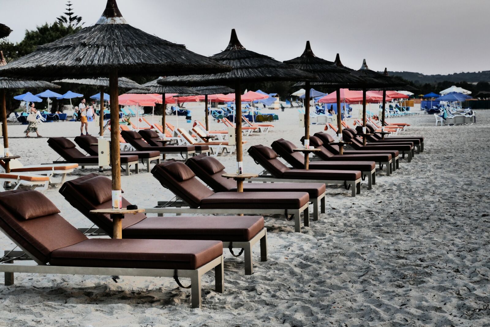 Panasonic DMC-TZ101 sample photo. Beach, parasols, concerns photography