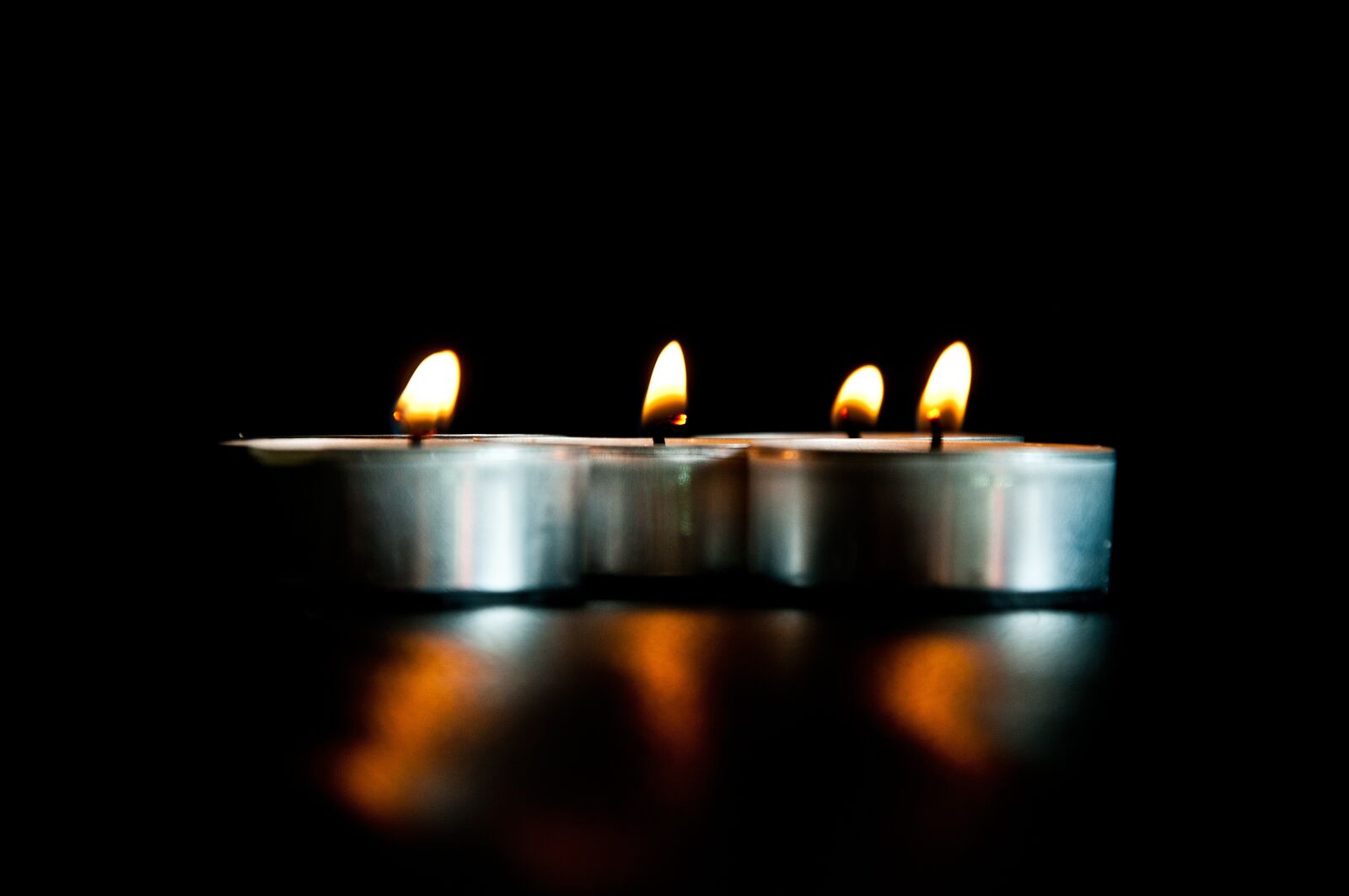Nikon D90 sample photo. Candles, black background, light photography