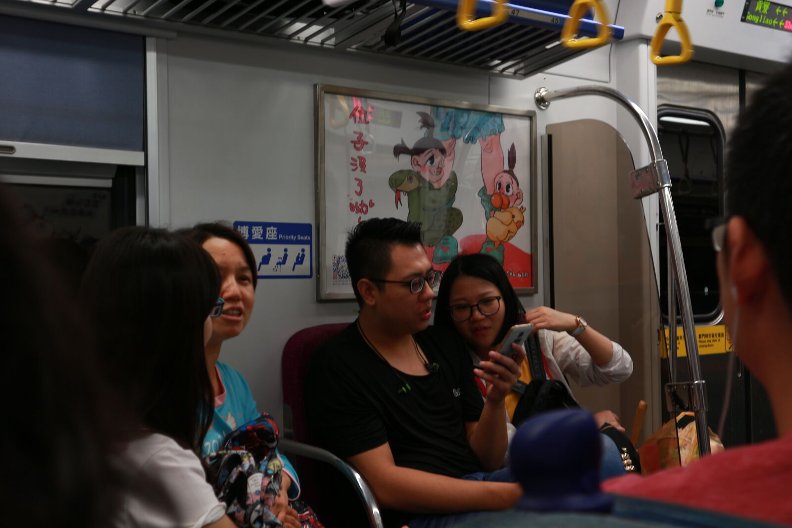 Canon EOS M sample photo. Young, couple, looking, at photography