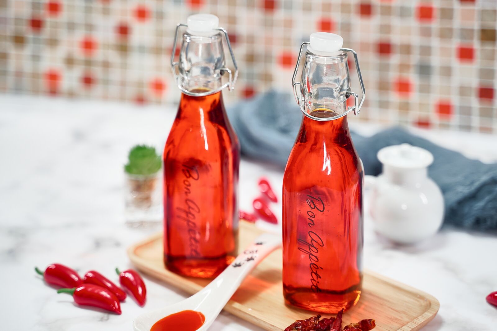 Tamron 28-75mm F2.8 Di III RXD sample photo. Chili oil, oil, herb photography