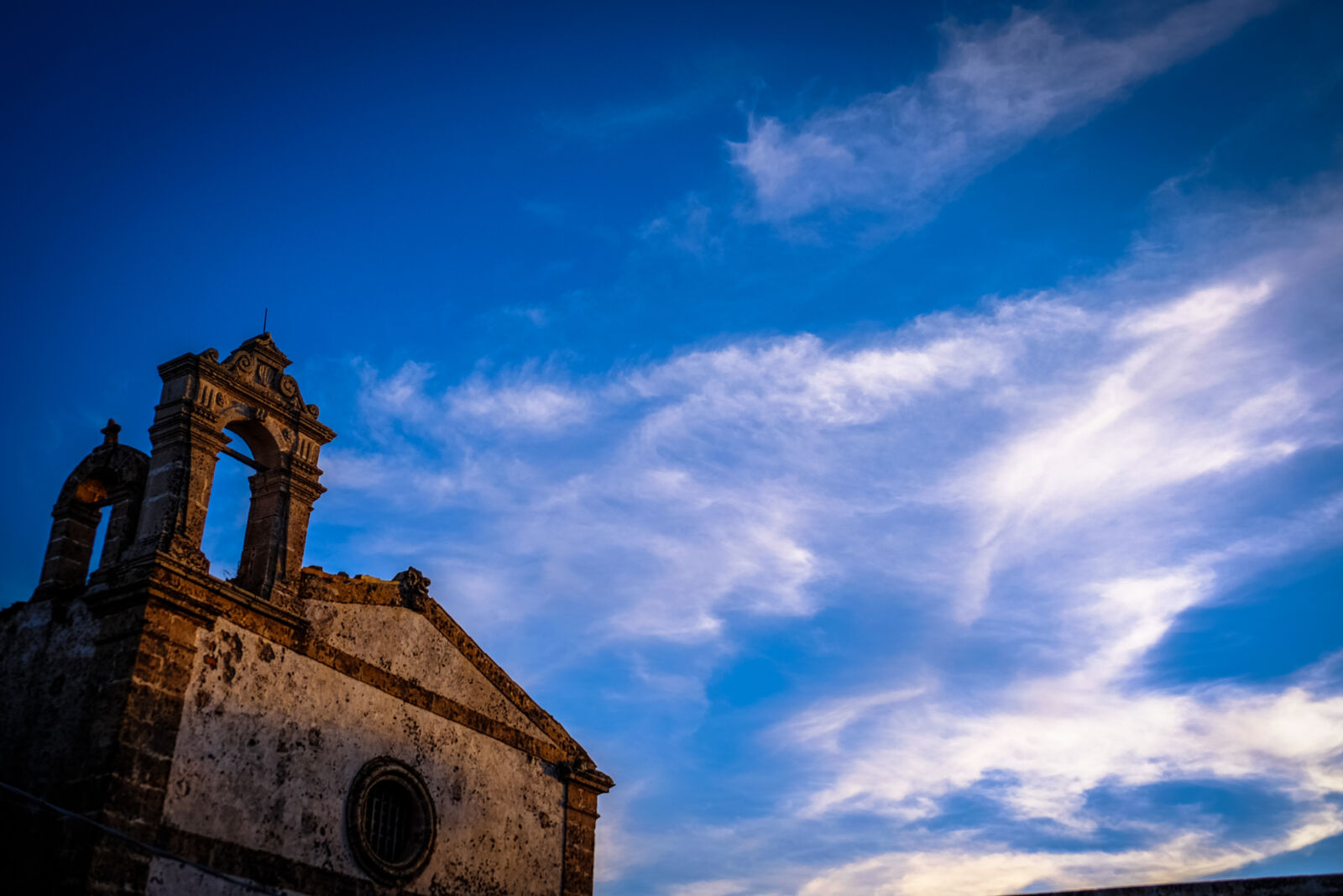 Fujifilm XF 18-135mm F3.5-5.6 R LM OIS WR sample photo. Sunset, clouds, church, blue photography