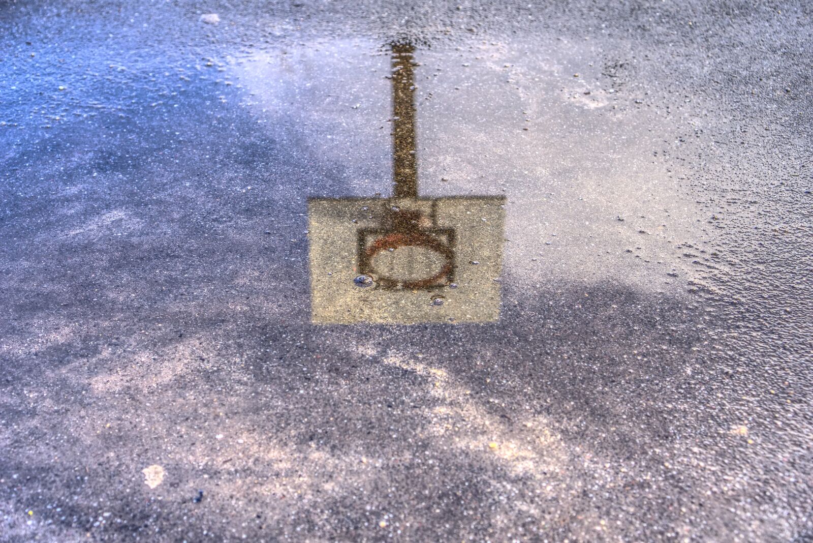 Sony a6000 + Sony E 35mm F1.8 OSS sample photo. Basketball hoop, puddle, mirroring photography