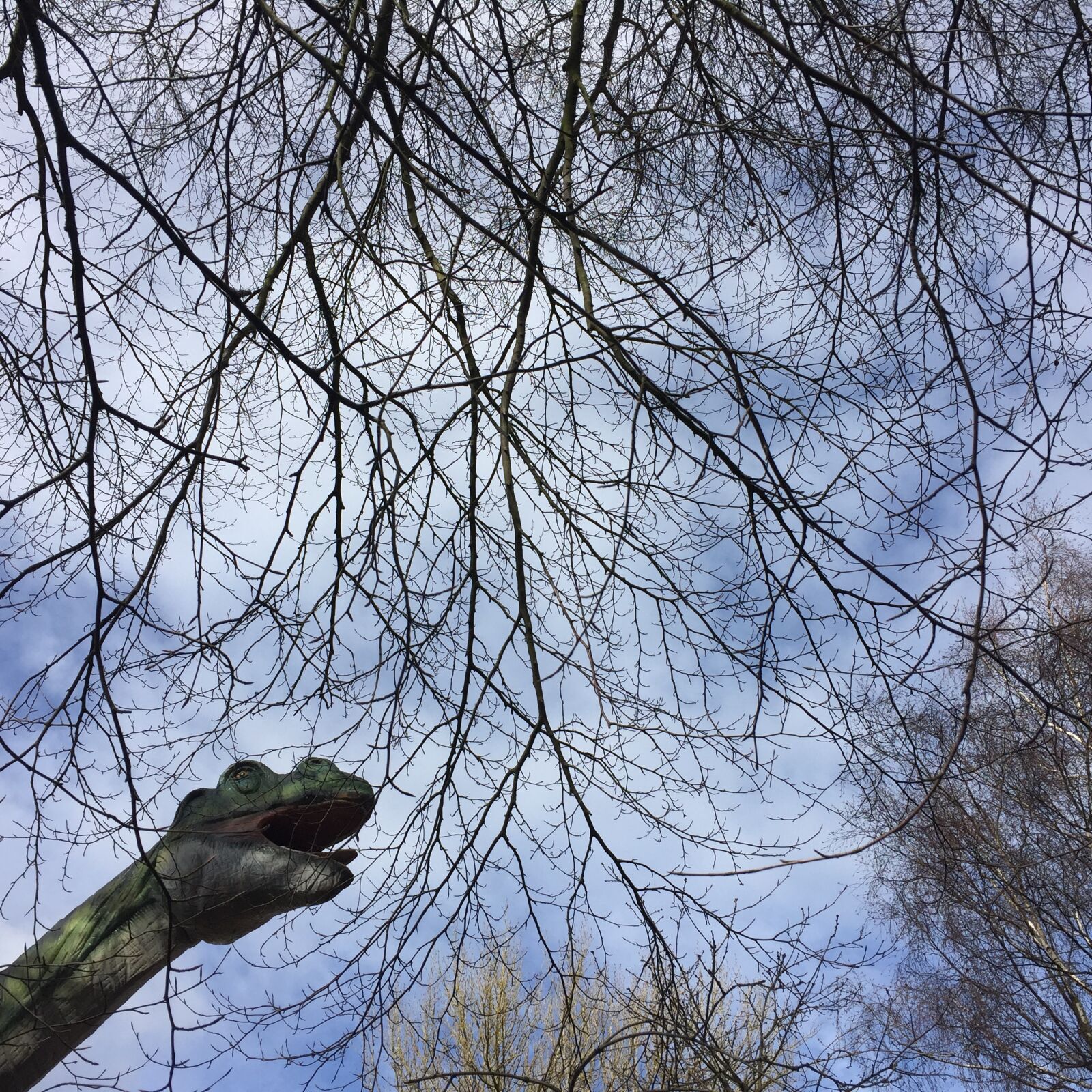 Apple iPhone 6 sample photo. Dinosaur, sky, trees photography