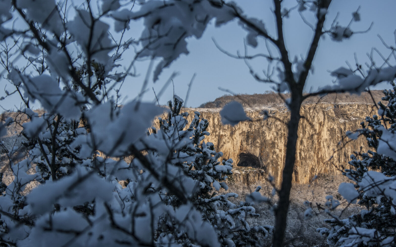 Canon EF-S 18-55mm F3.5-5.6 II sample photo. Cave, forest, hidden, snow photography