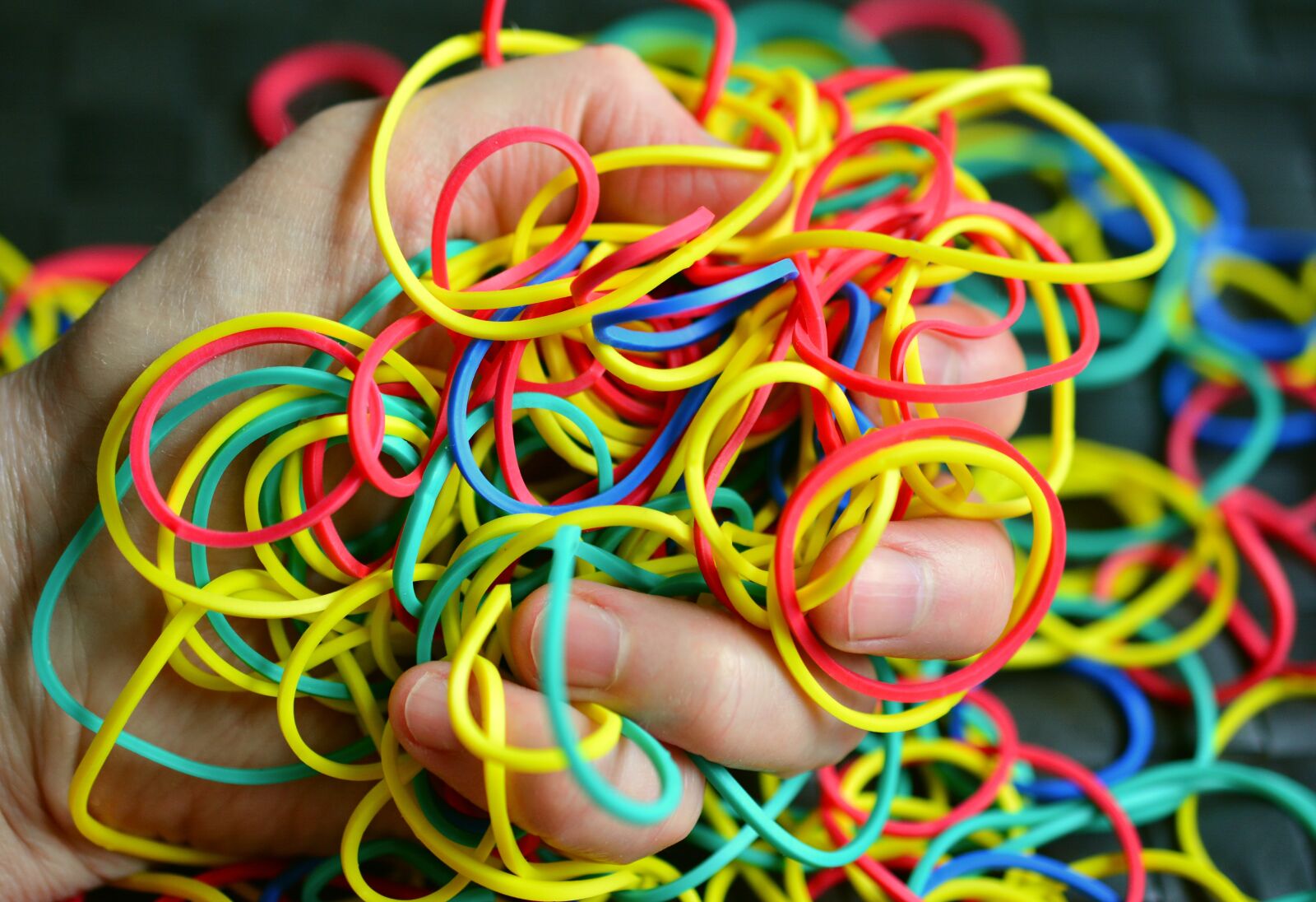Nikon D5200 sample photo. Rubber rings, rubber, hand photography