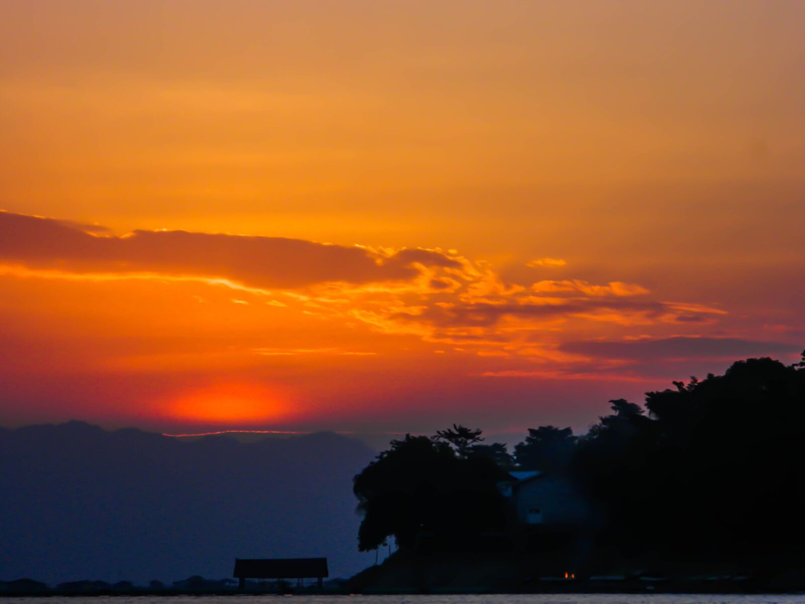 Nikon COOLPIX L310 sample photo. Sunset, behind, hill photography