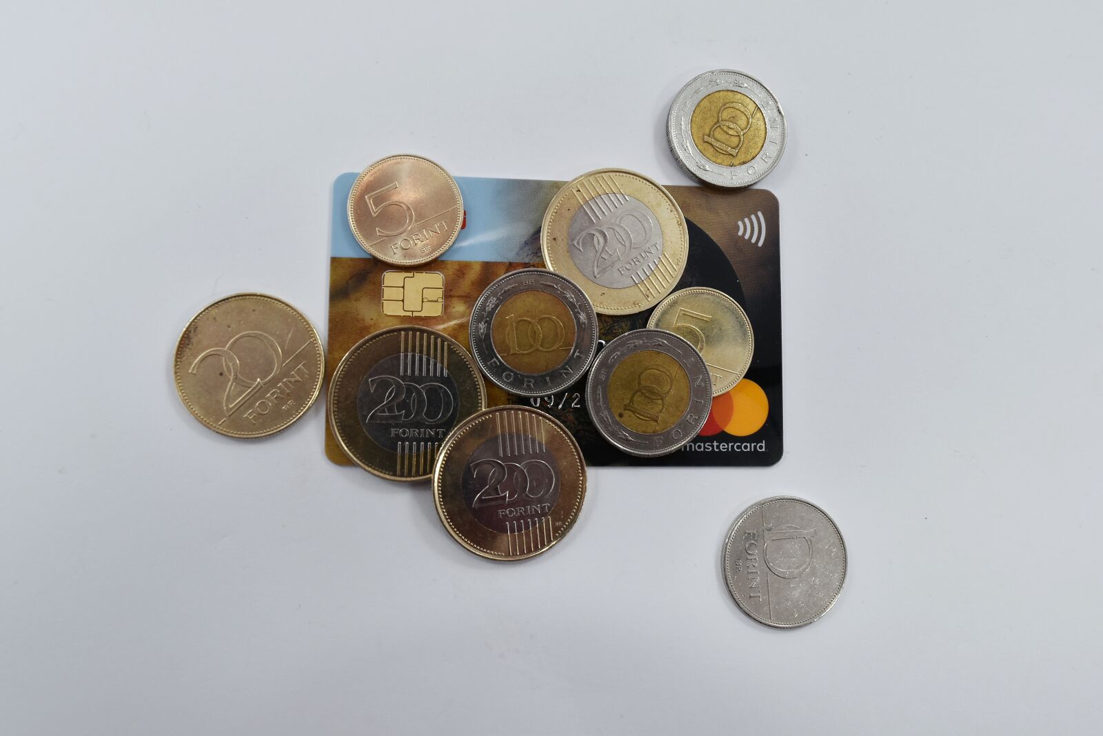 Nikon D5500 sample photo. Coins, credit, economic growth photography