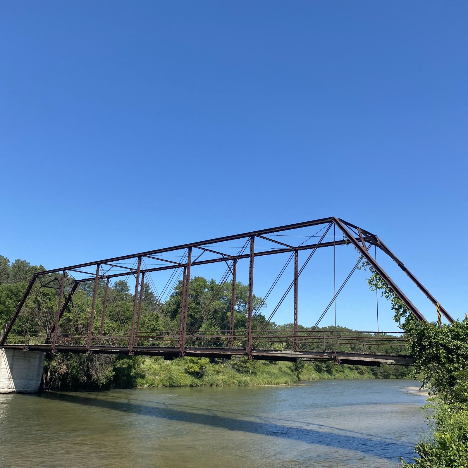 Apple iPhone 11 Pro Max + iPhone 11 Pro Max back triple camera 4.25mm f/1.8 sample photo. Bridge, niobrara river, blue photography