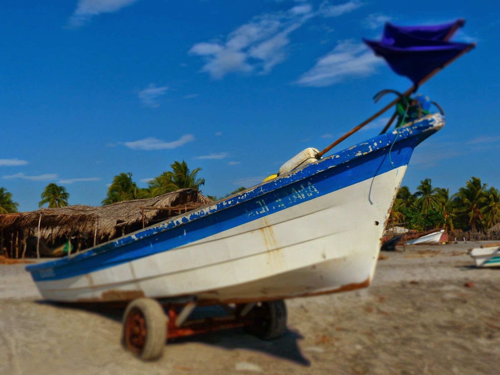 Panasonic Lumix DMC-FZ200 sample photo. Boat, sea, beach photography