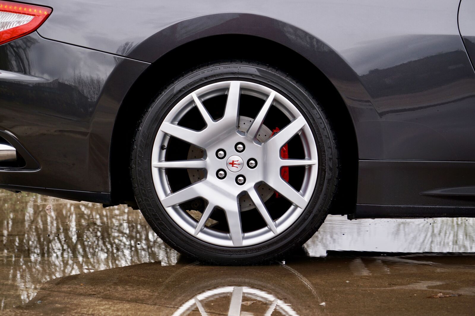 Sony E 55-210mm F4.5-6.3 OSS sample photo. Car, wheel, tire photography