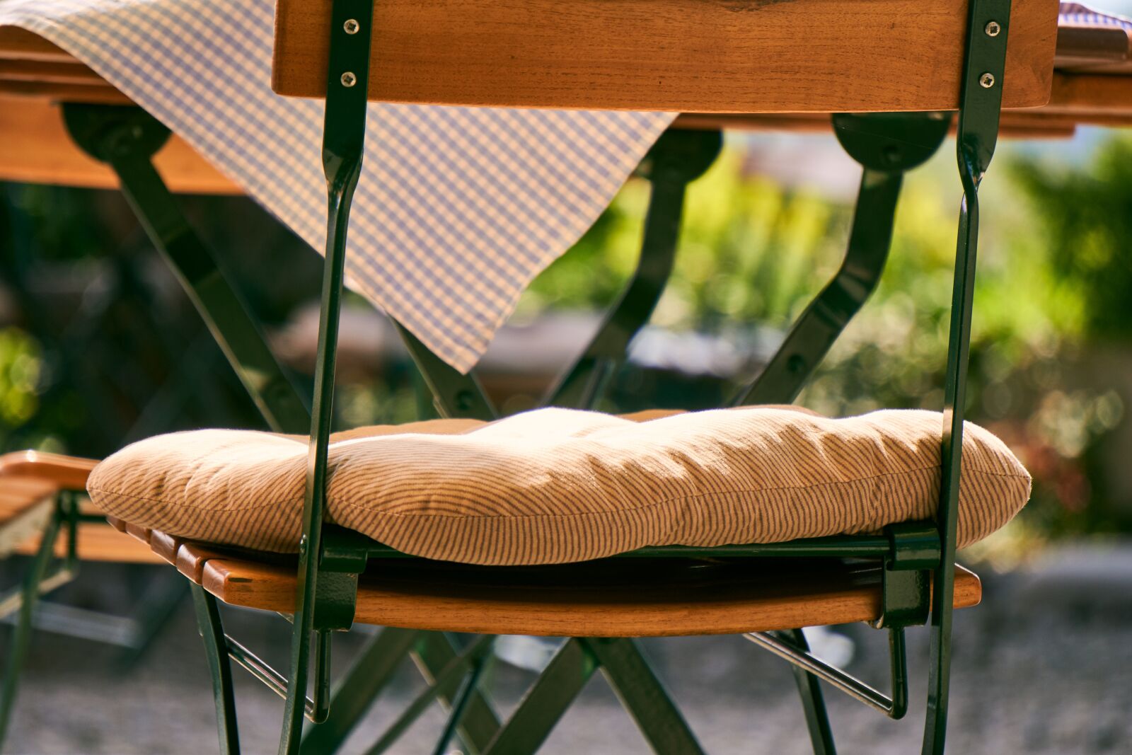 Sony E 55-210mm F4.5-6.3 OSS sample photo. Beer garden, chair, bistro photography