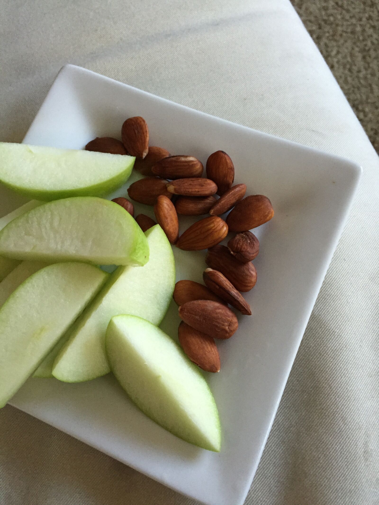Apple iPhone 6 sample photo. Snack, green apple, almonds photography