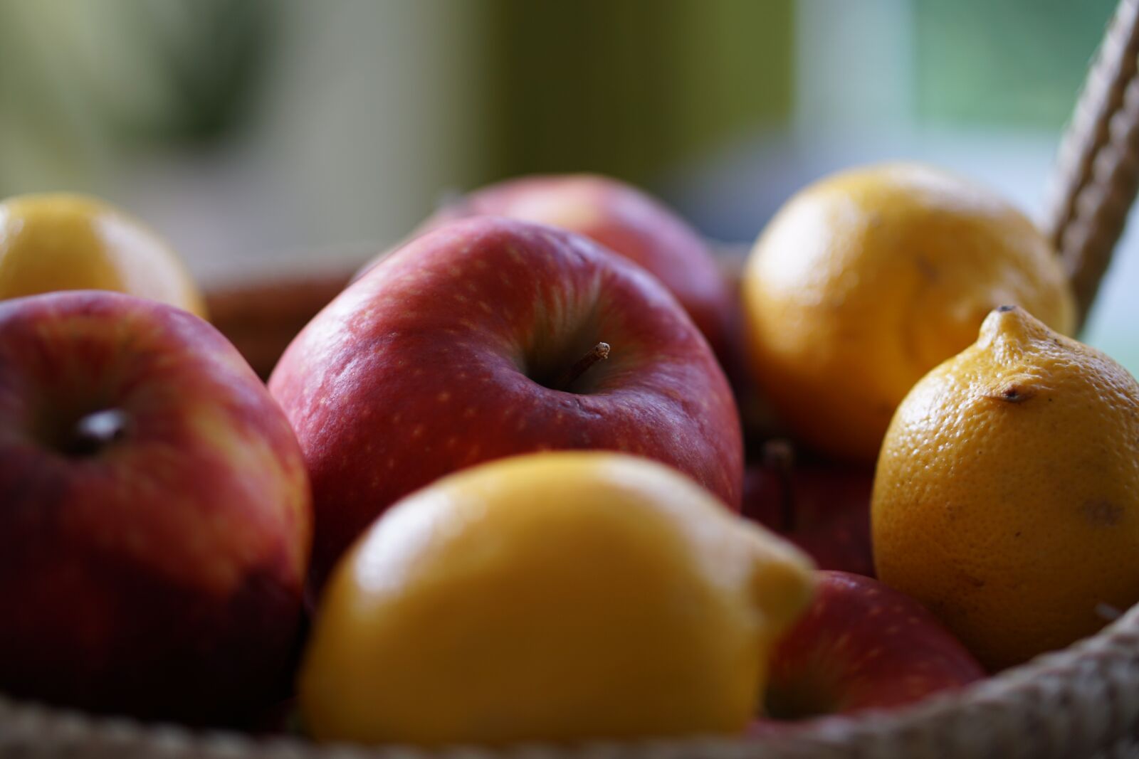 E 50mm F1.8 OSS sample photo. Apple, lemon, basket photography