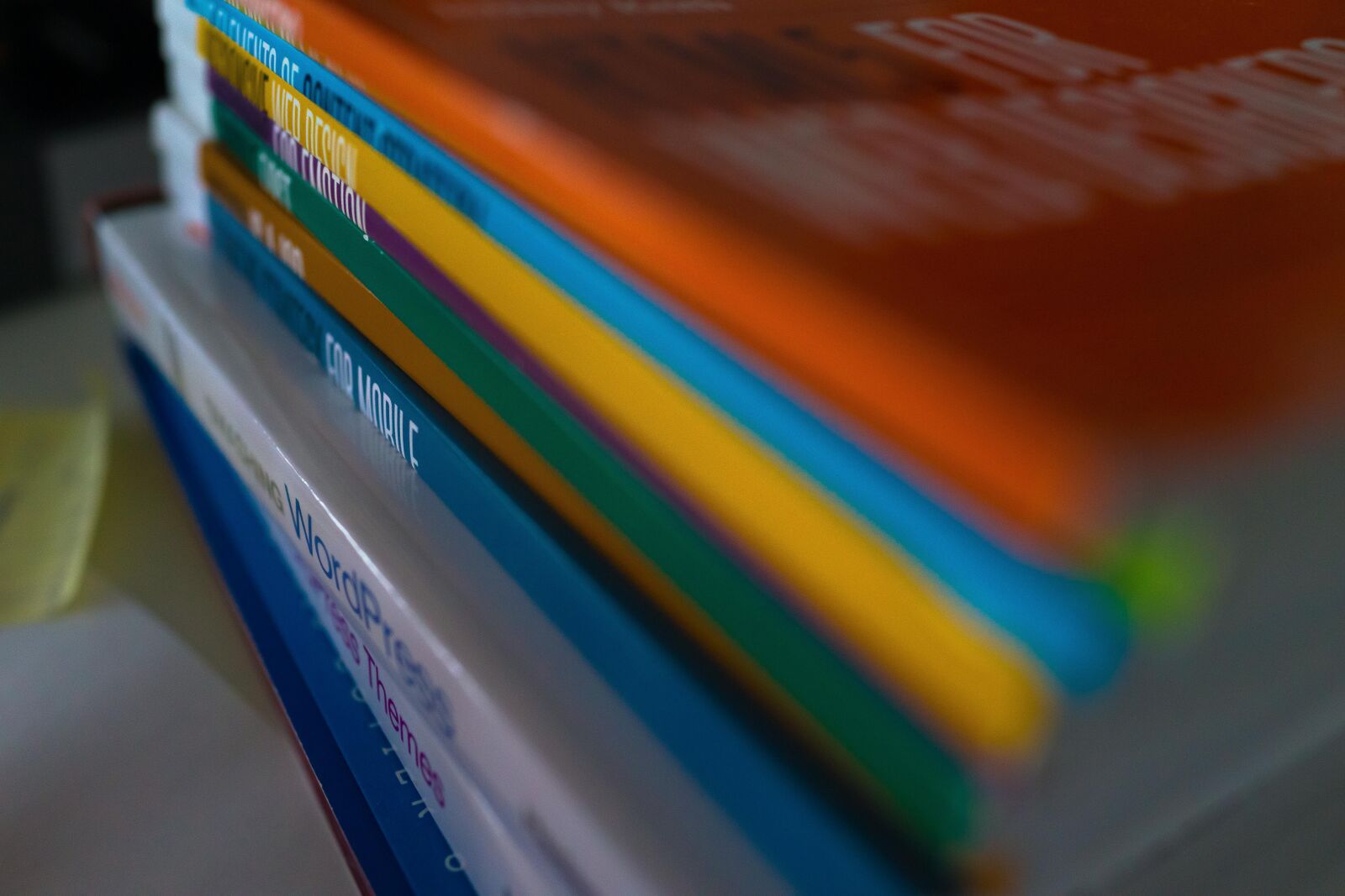 35mm F2.0 sample photo. Books, book stack, colorful photography