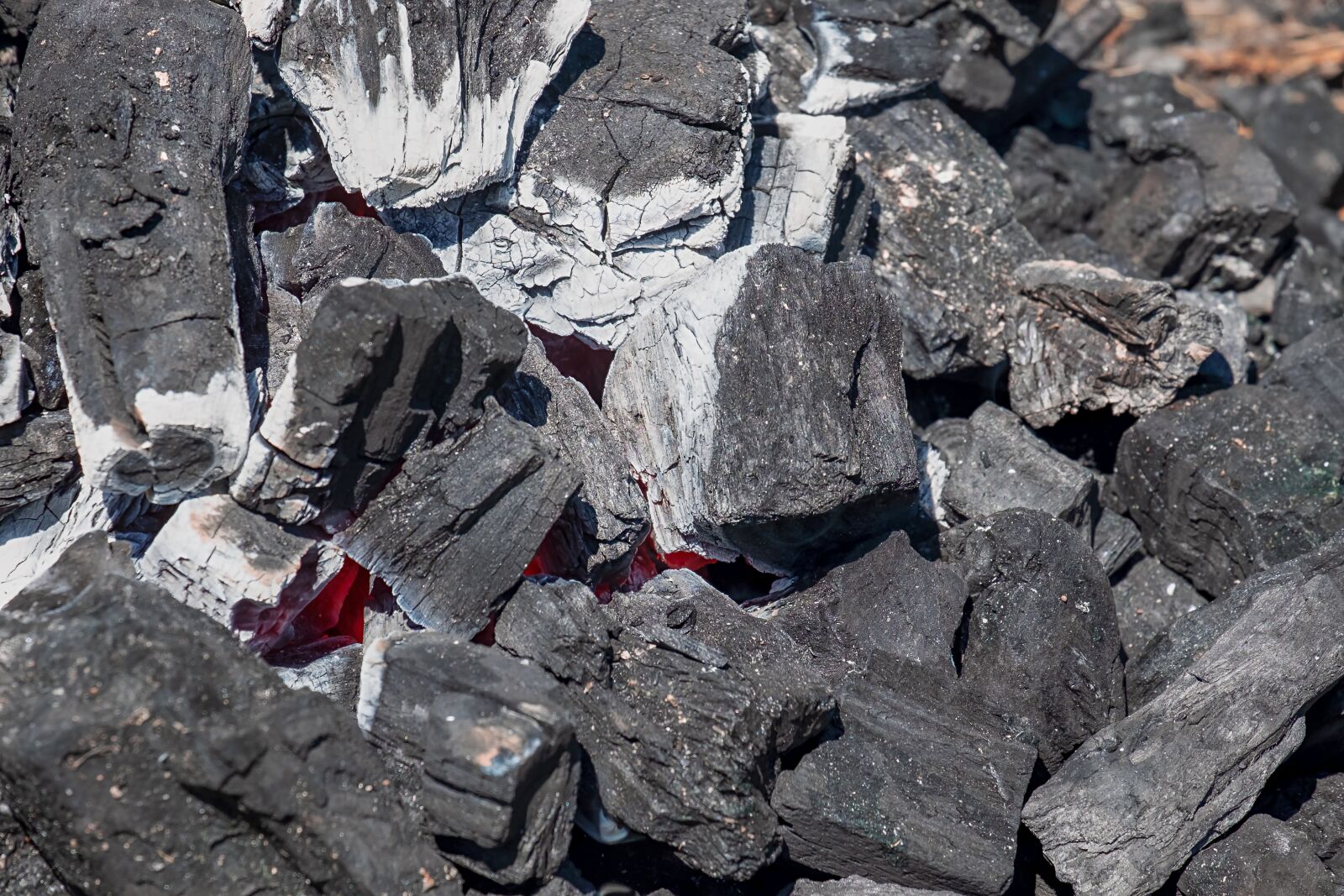 Fujifilm XF 55-200mm F3.5-4.8 R LM OIS sample photo. Charcoal, embers, hot photography