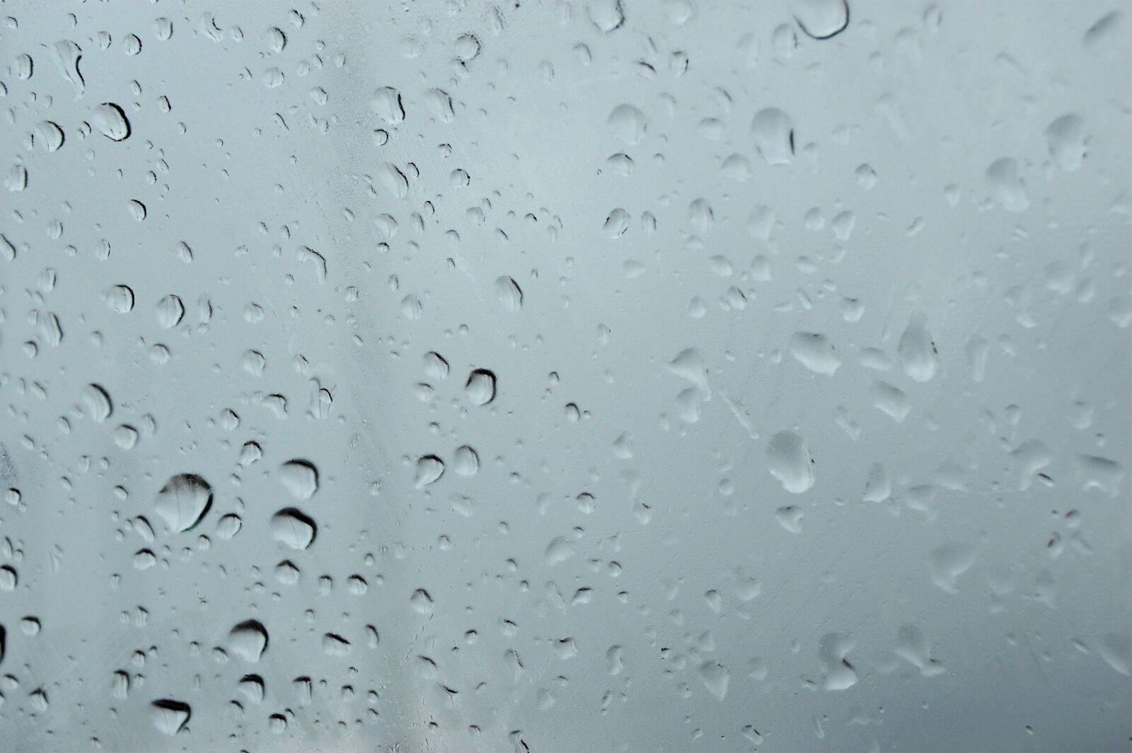 Nikon AF-S DX Nikkor 18-55mm F3.5-5.6G II sample photo. Car, window, rain, rain photography