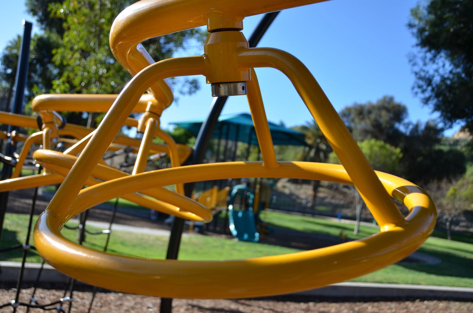 Nikon D7000 sample photo. Yellow bars, playground, child photography
