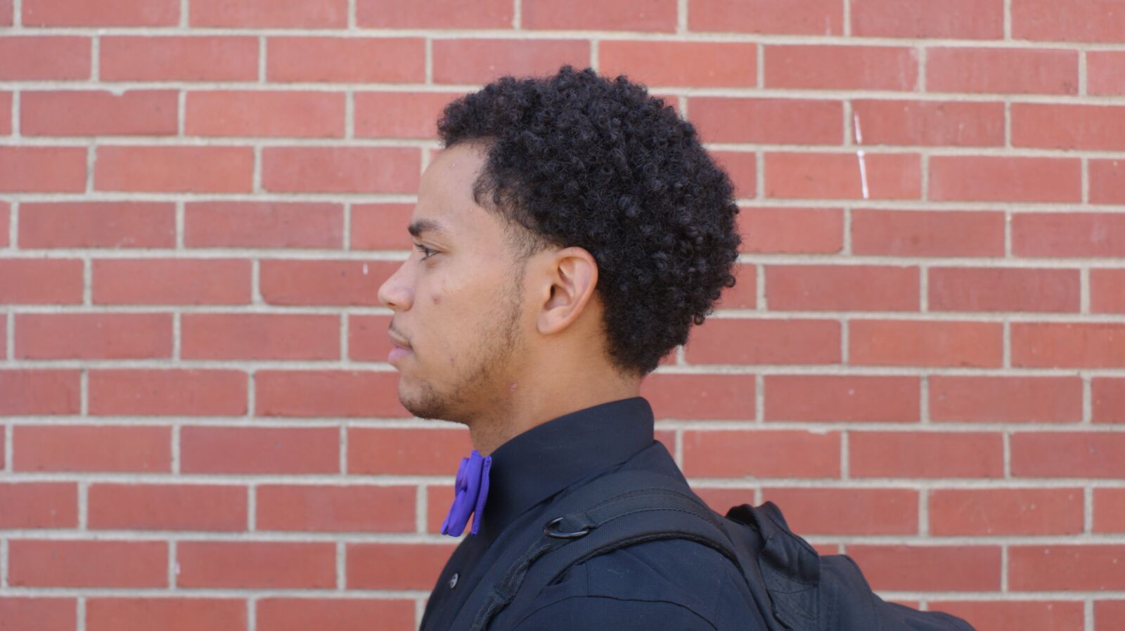 Sony Alpha DSLR-A350 sample photo. Side profile, black male photography