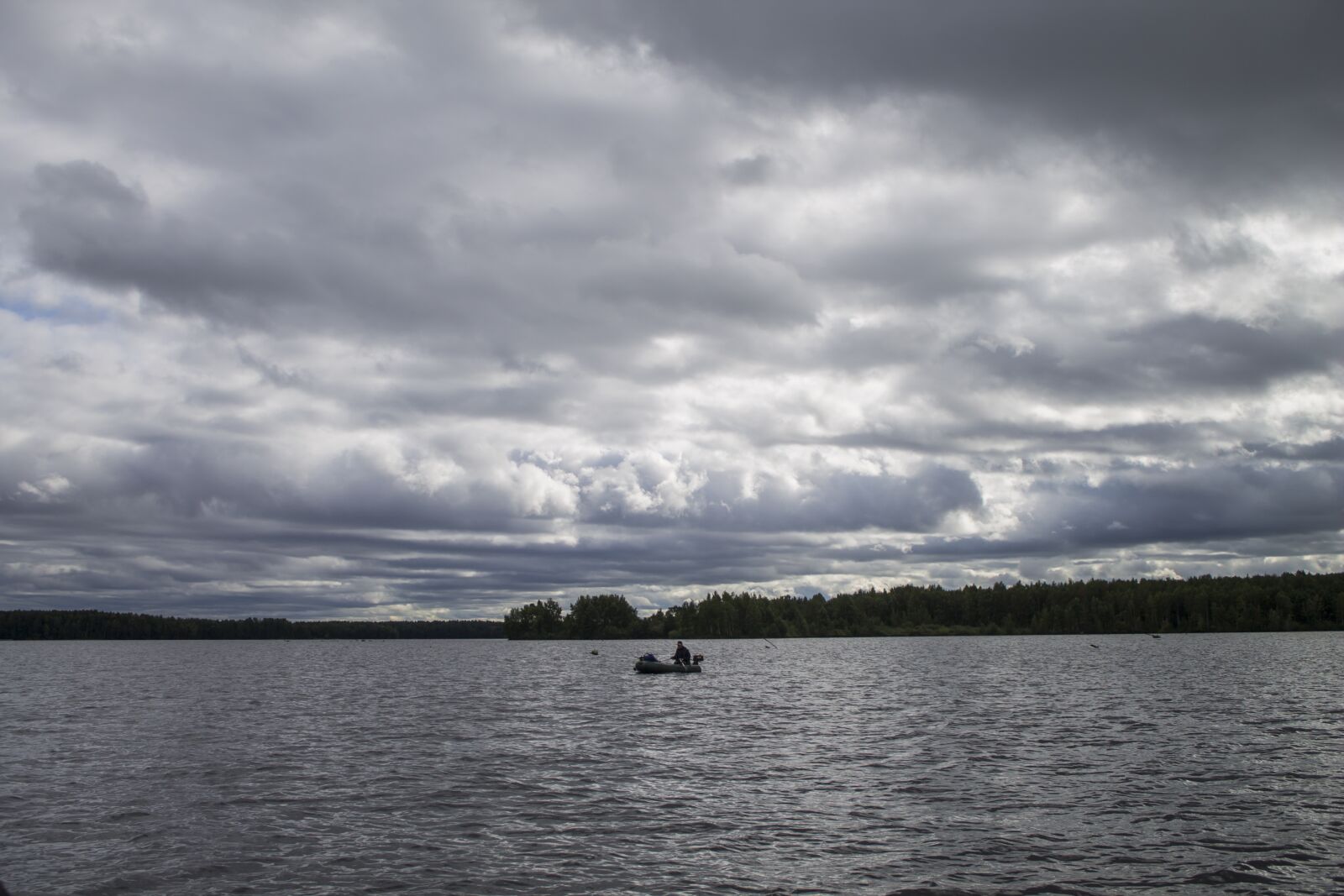 Canon EOS 1100D (EOS Rebel T3 / EOS Kiss X50) sample photo. Fisherman, water, clouds photography