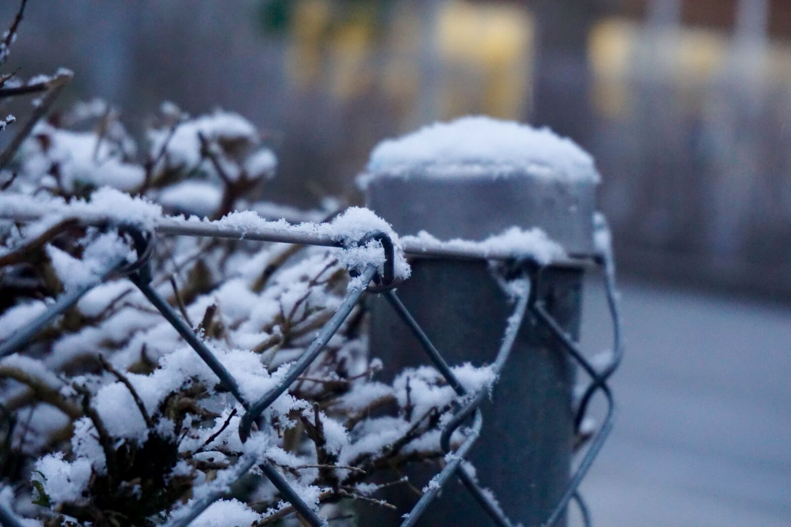 Sony a5100 + Sony E 16-50mm F3.5-5.6 PZ OSS sample photo. Blur, fence, snow, snowflake photography