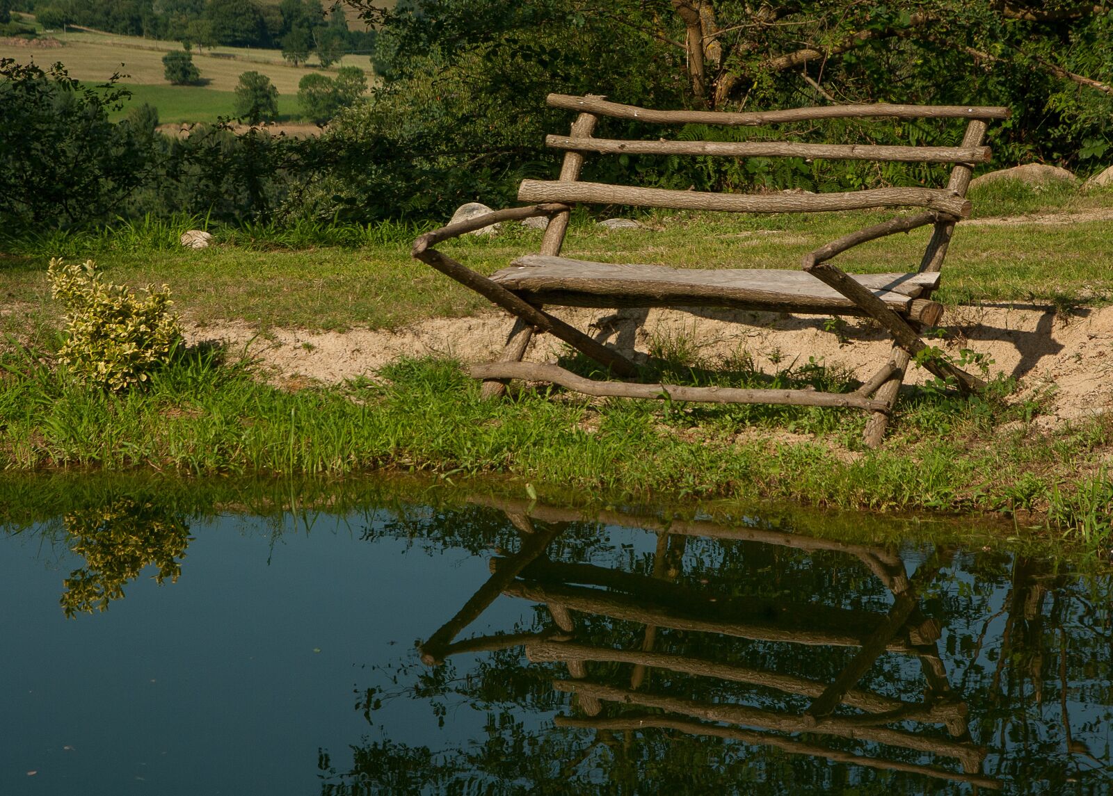 Pentax K10D sample photo. Lake, bench, reflections photography