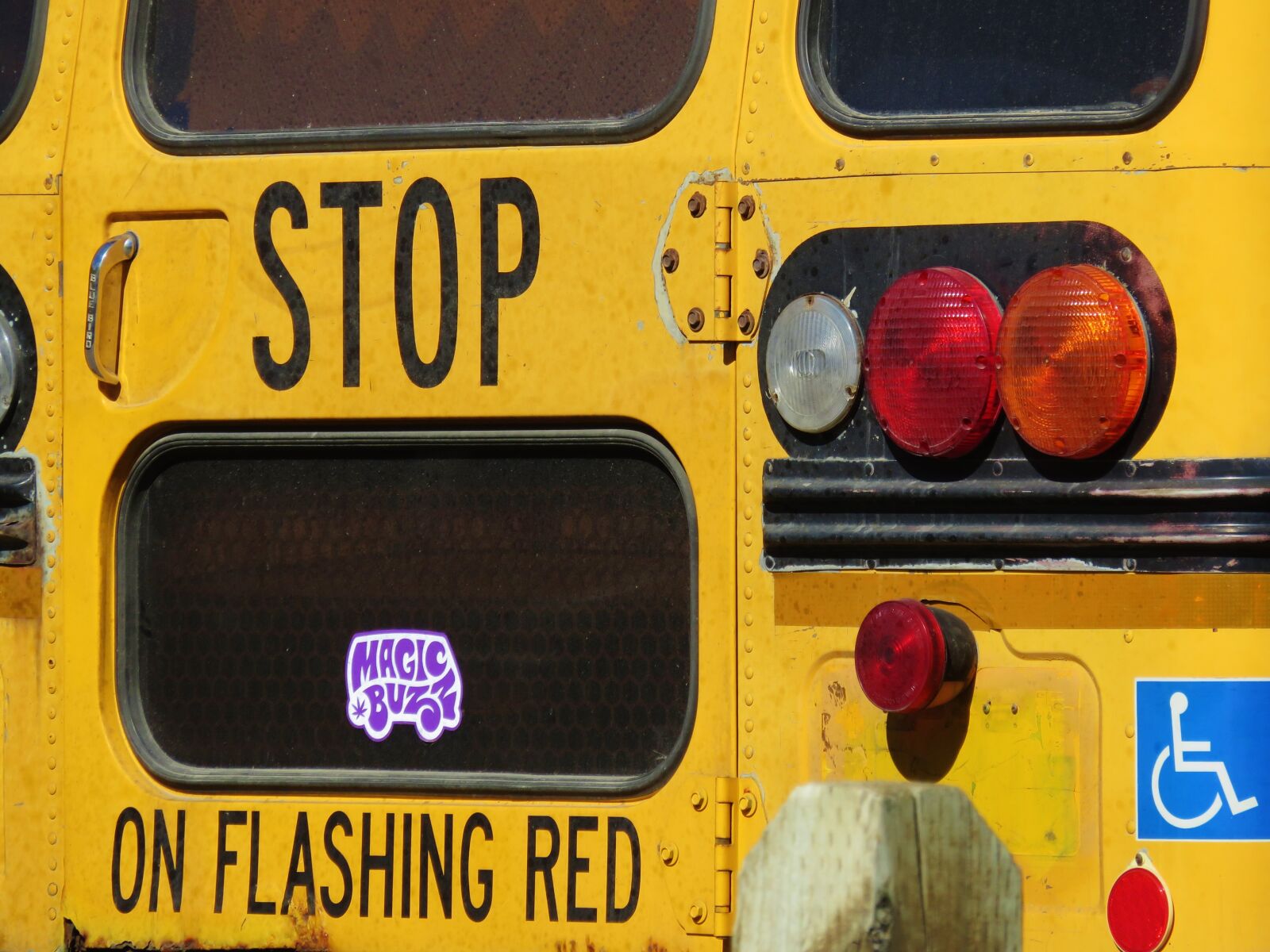 Canon PowerShot SX700 HS sample photo. Stop, bus, yellow photography
