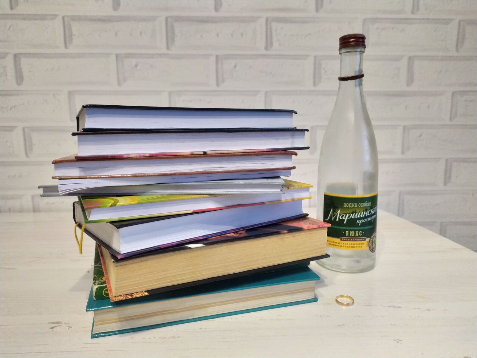 Xiaomi Redmi Note 7 sample photo. Books, vodka, wedding ring photography
