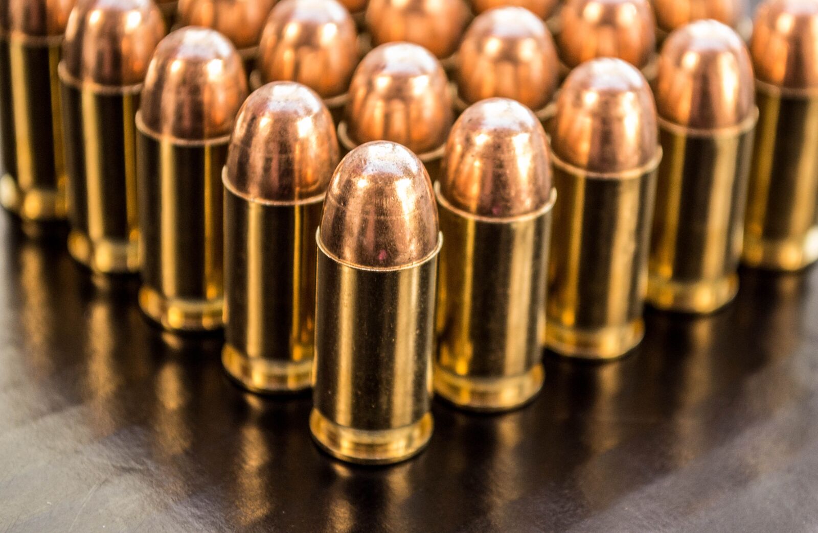 Nikon D3100 sample photo. Bullets, brass 9mm, shiny photography