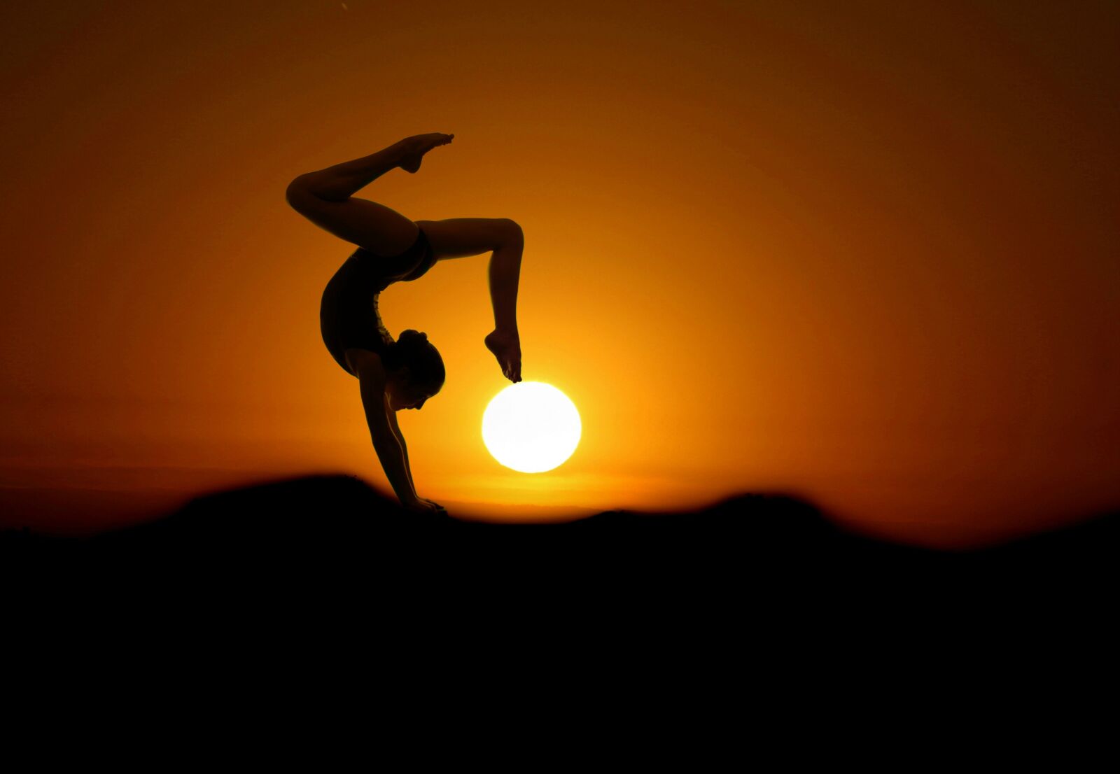Canon EOS 7D Mark II sample photo. Gymnast, sunset, silhouette photography