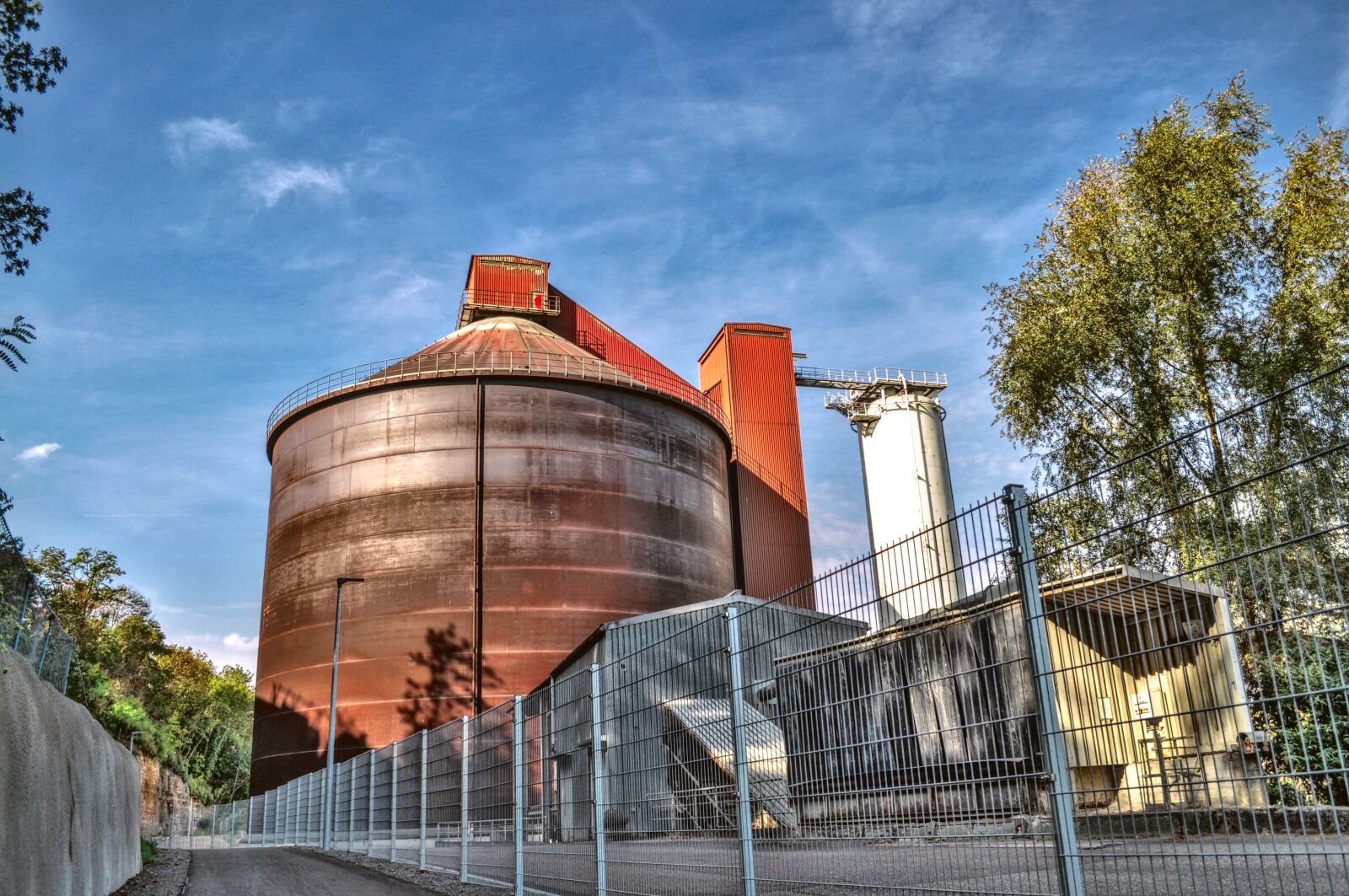 Nikon D5000 sample photo. Cement plant, silo, bicycle photography