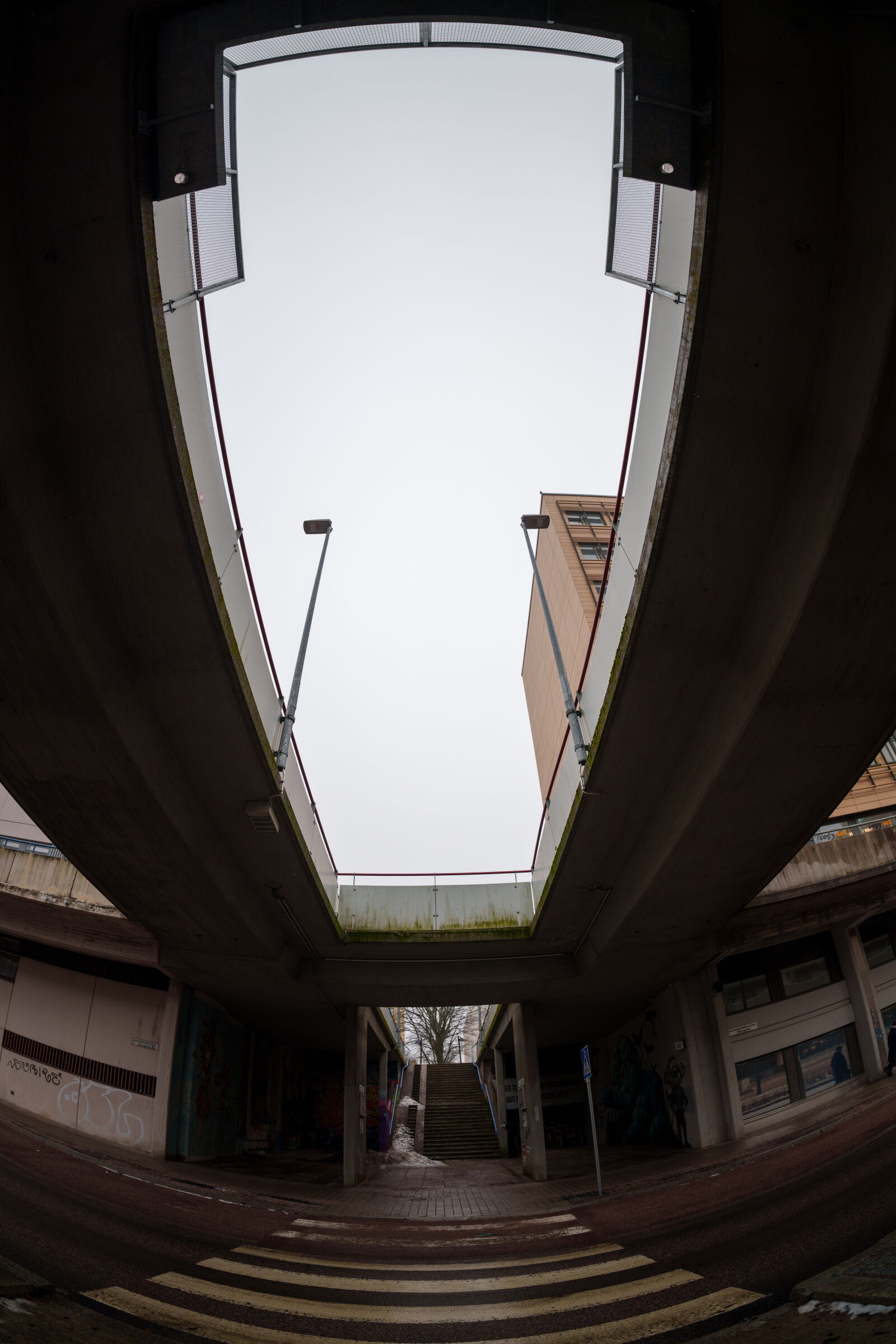 Sigma 15mm F1.4 DG DN Diagonal Fisheye Art sample photo. Bridge over street photography