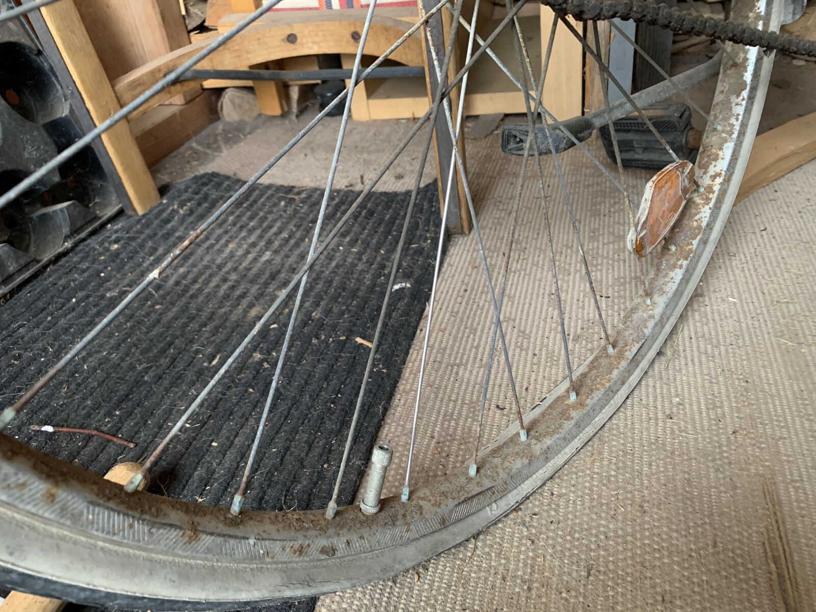 iPhone XS back dual camera 4.25mm f/1.8 sample photo. Bike, flat tyre, slabs photography