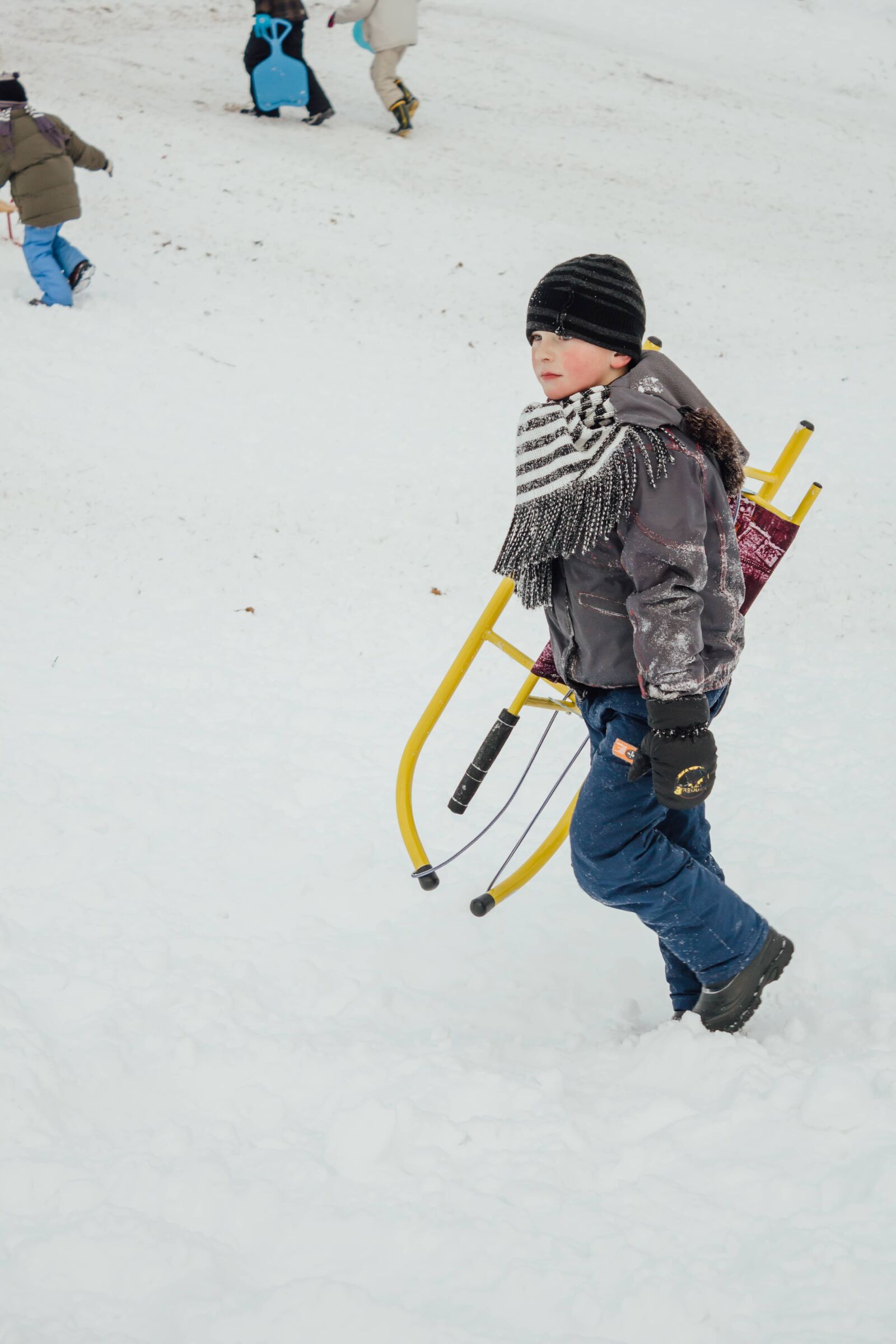 Canon EF-S 18-55mm F3.5-5.6 IS sample photo. Boy, school child, sled photography