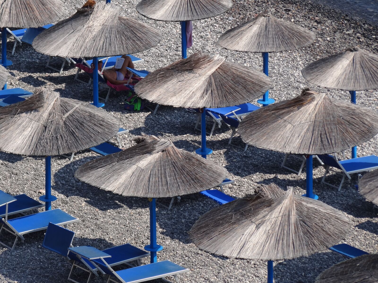 Sony Cyber-shot DSC-HX100V sample photo. Parasols, beach, concerns photography