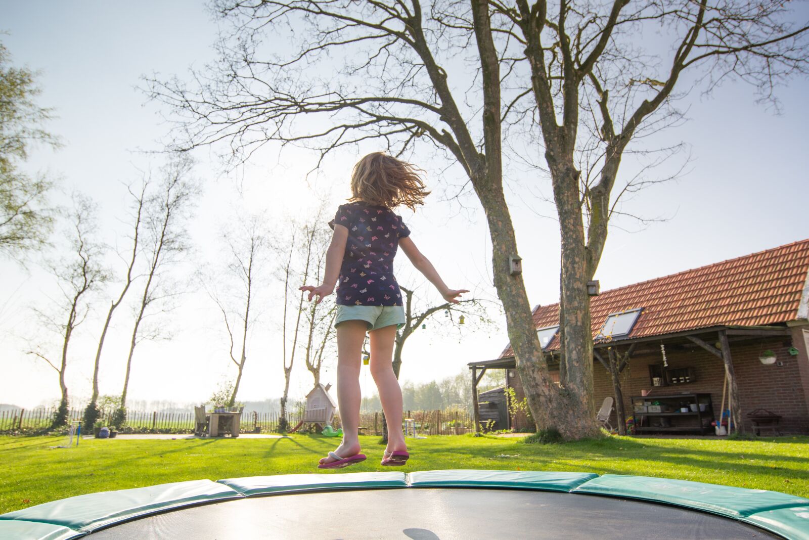 Nikon D610 sample photo. Trampoline, girl, play photography