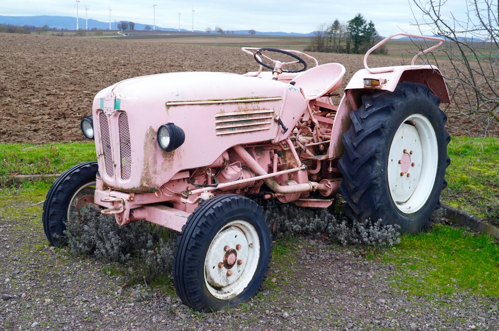 Sony E PZ 18-105mm F4 G OSS sample photo. Tractor, pink, farm photography
