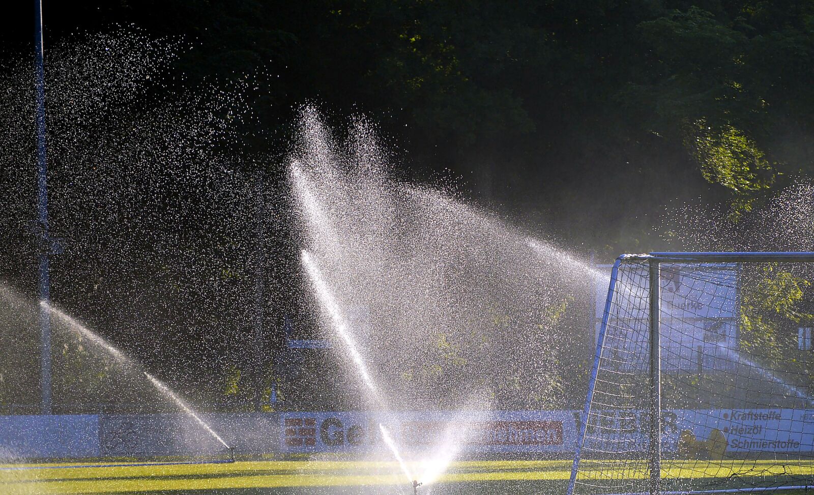 Nikon D3200 sample photo. Football pitch, sprinkler system photography